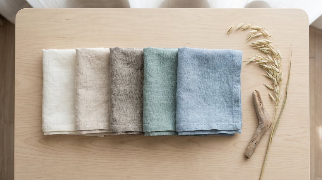Coastal bedroom color palette: white, sandy beige, driftwood grey, sage and soft blue linen swatches