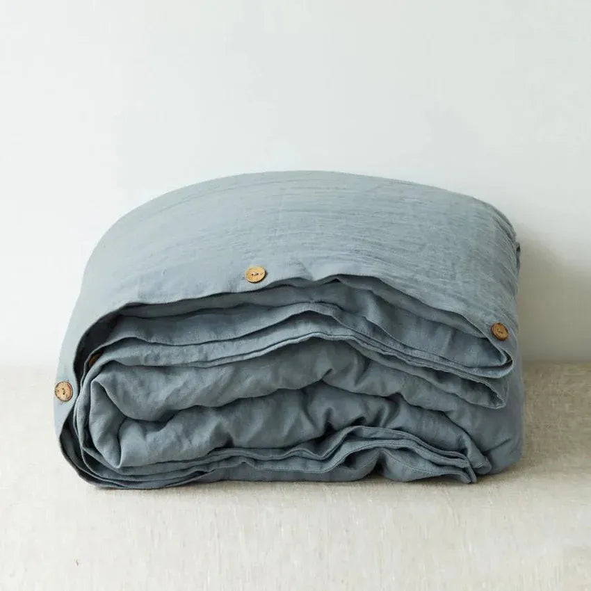 Blue fog linen duvet cover on a bed