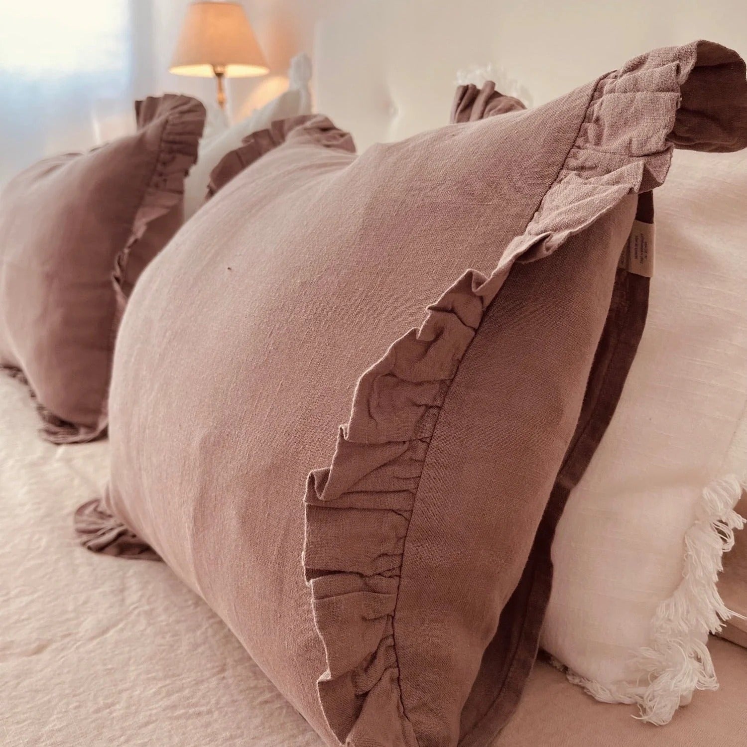 Ashes of roses frilled linen pillowcase close-up