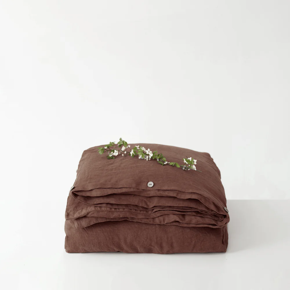 Chocolate brown linen duvet cover on a bed