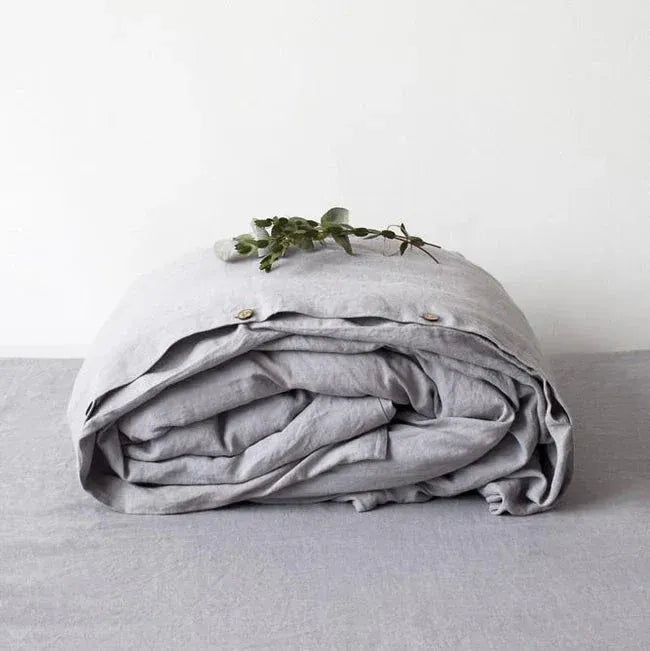 Light grey linen duvet cover on a bed