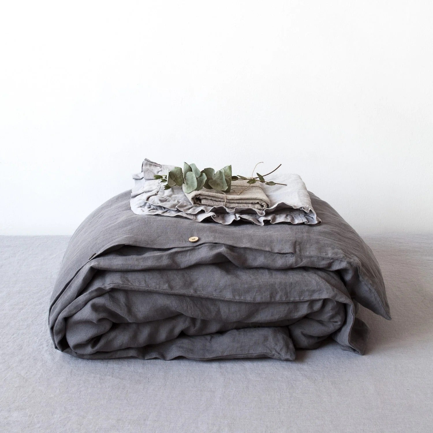 Dark grey linen duvet cover on a bed