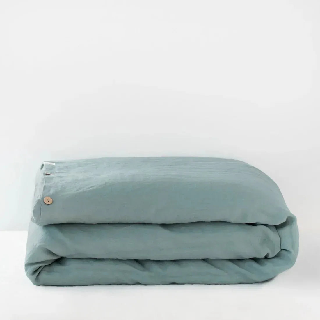 Green milieu linen duvet cover on a bed