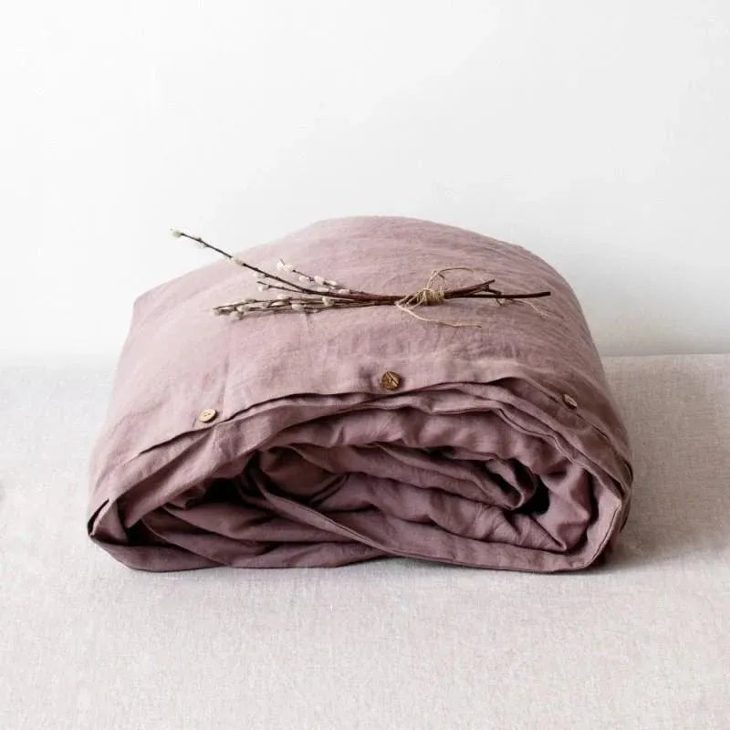 Ashes of roses pink linen duvet cover on a bed