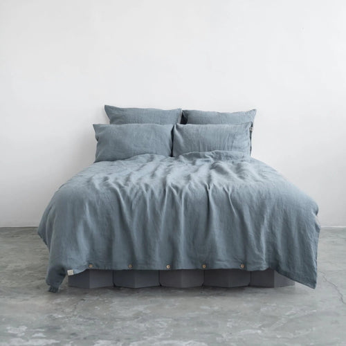 Blue fog linen duvet cover set on a made bed