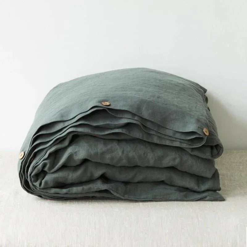 Forest green linen duvet cover on a bed