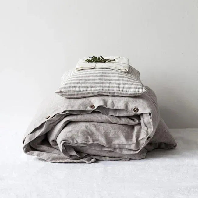Melange grey linen duvet cover on a bed
