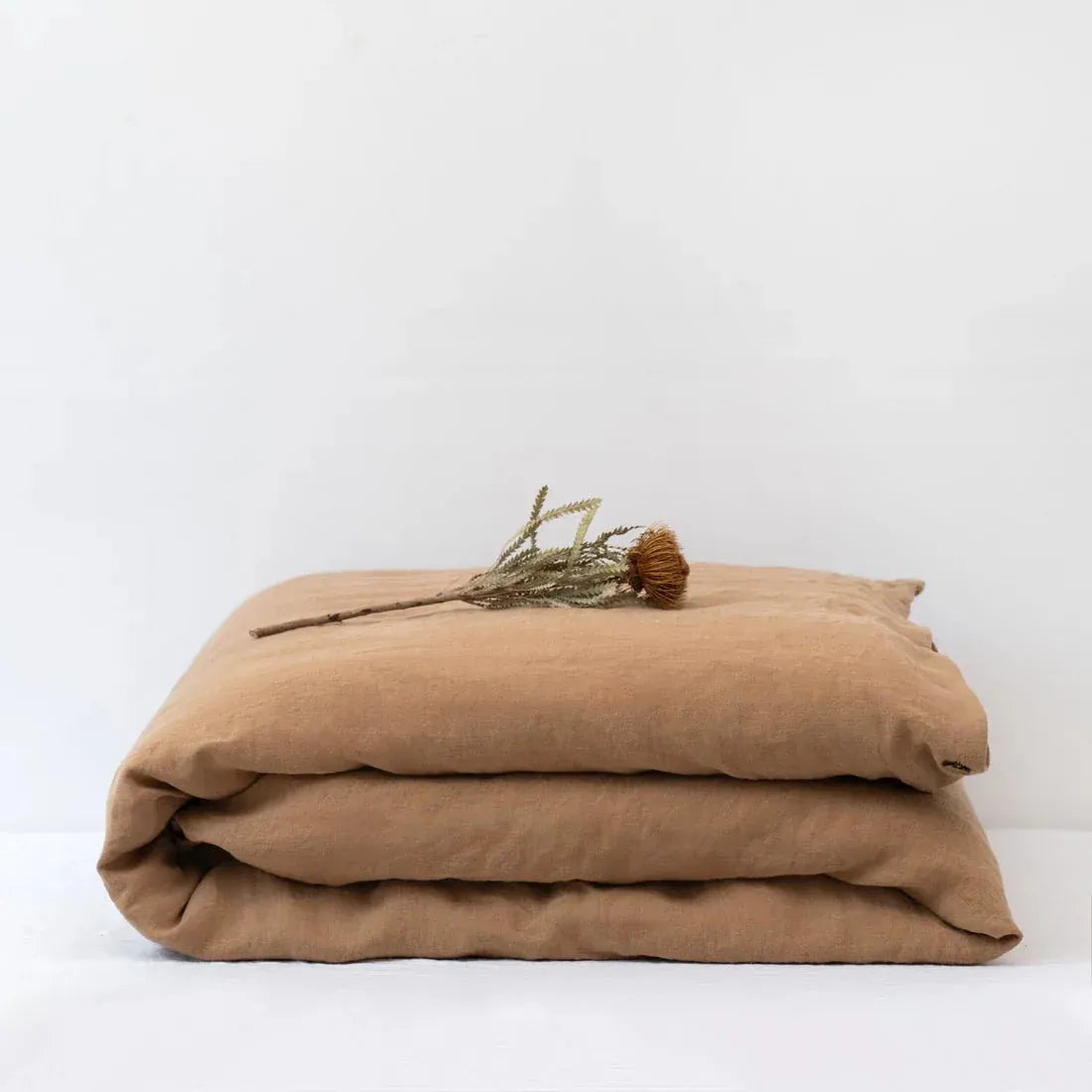 Camel linen duvet cover on a bed