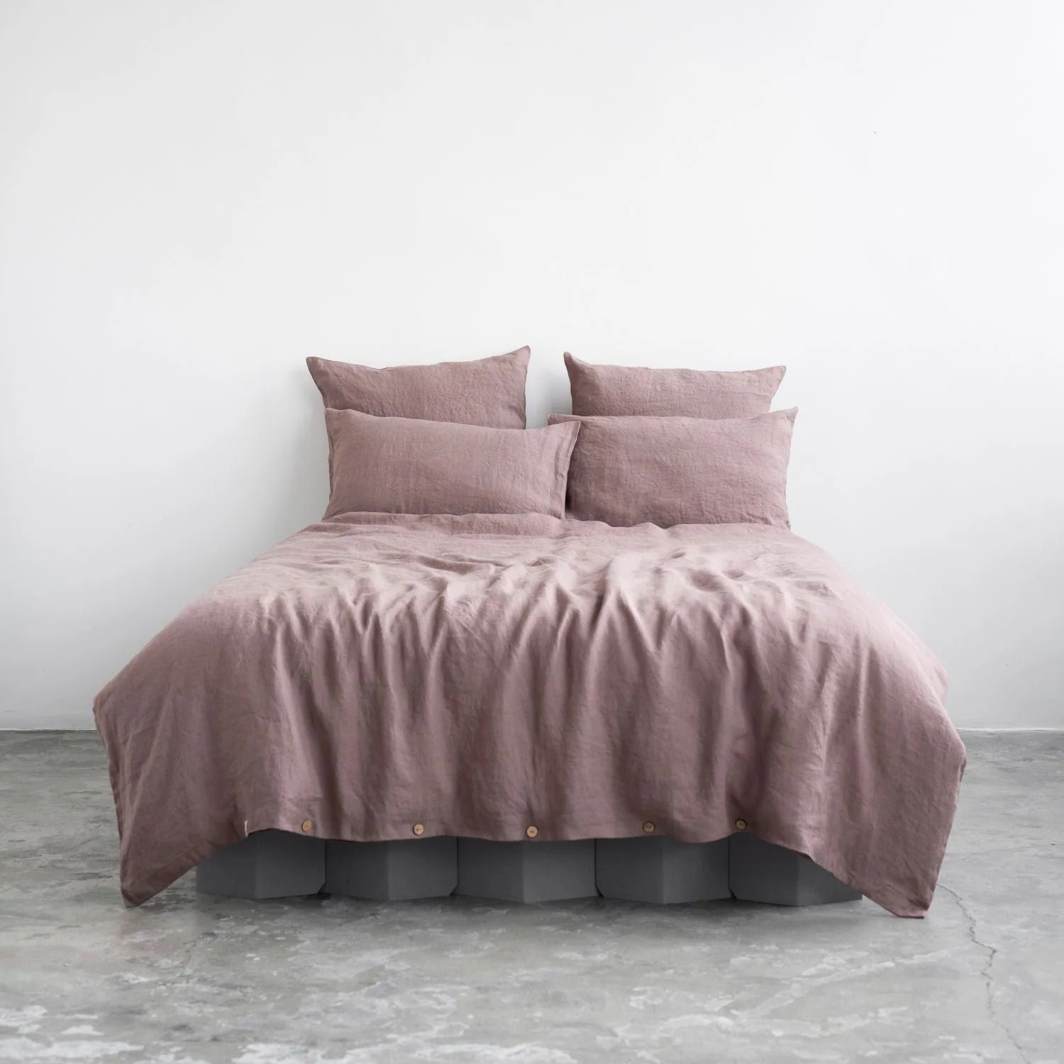 Ashes of roses pink linen duvet cover set on a bed