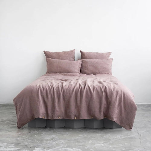 Ashes of roses pink linen duvet cover set on a bed